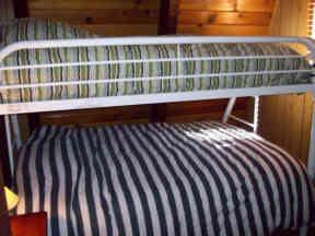 Bunk bed with double and twin bed come with electric blankets for a warm, comfortable night.